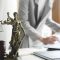 Business woman in suit or lawyer working on a documents. Legal law, advice and justice concept.