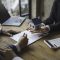 Real estate agent and couple enter into contracts for the sale of houses and land Approval of a contract to buy and sell a house Offers mortgage loans and home insurance ideas.