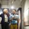 Portrait of two cheerful museum workers discussing paintings walking in art gallery, copy space